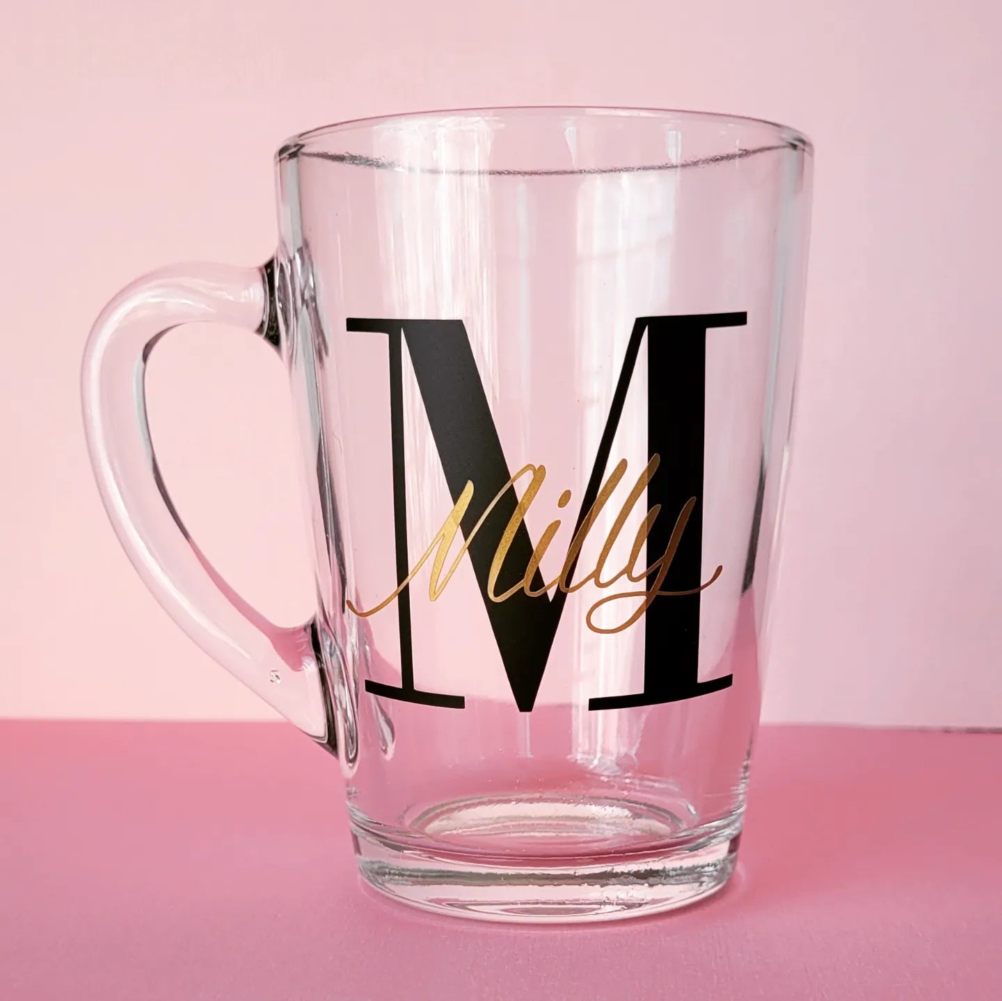 personalised glass mug. tempered glass. holds 320ml of liquid. black intital and gold written name. perfect for gifts